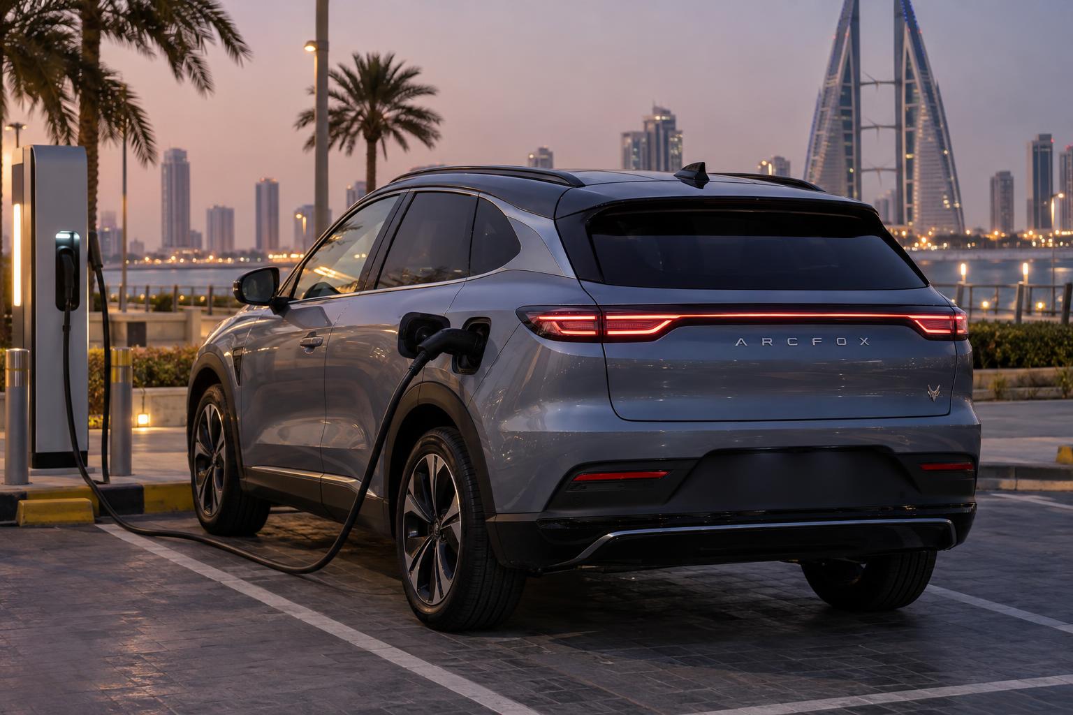 An Arcfox electric vehicle connected to a public charging station in Bahrain.