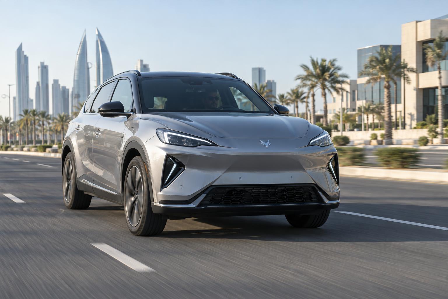 An Arcfox electric crossover being driven on a modern road in Bahrain.