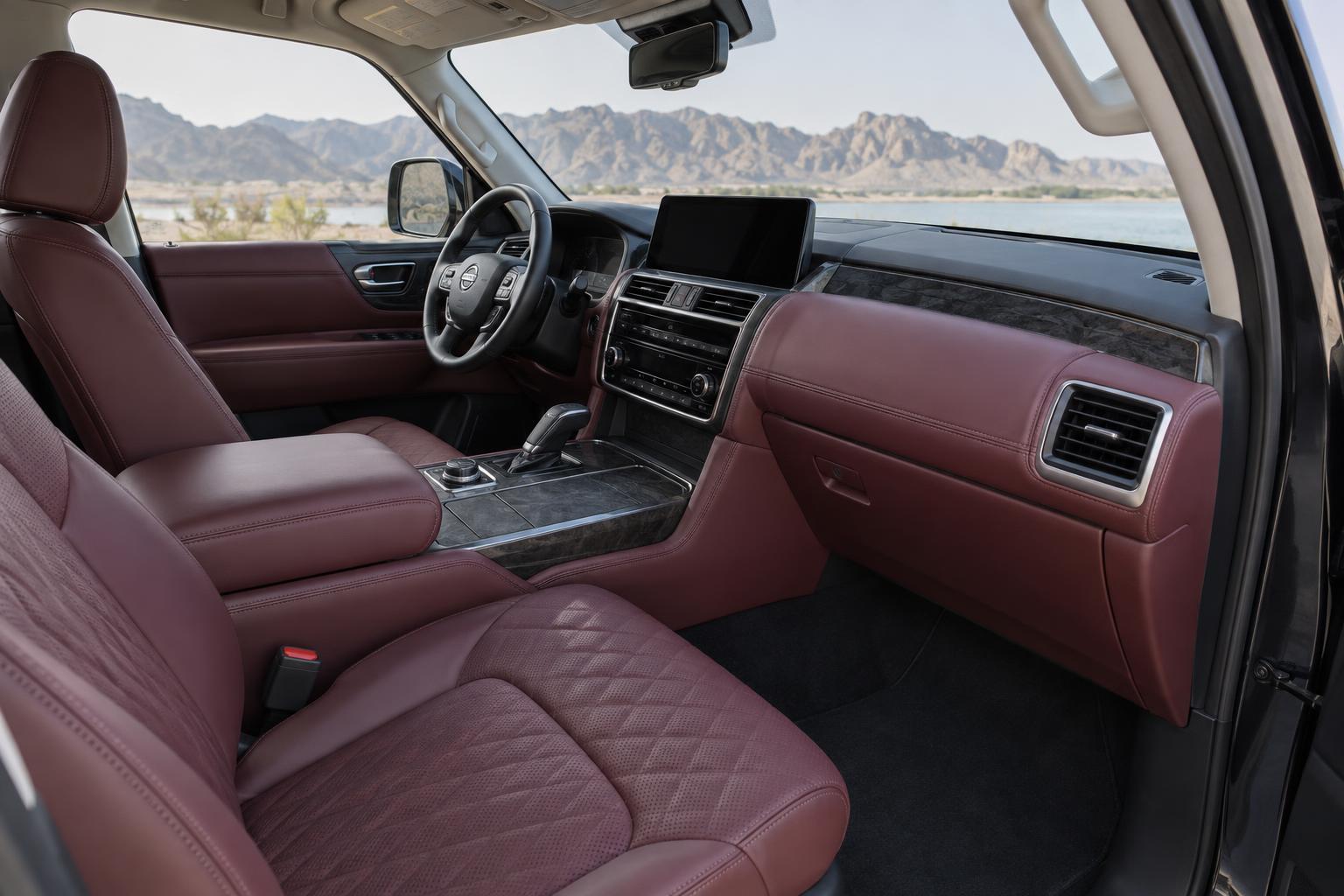 Front cabin of the Nissan Patrol 75th Anniversary Edition showing Bordeaux leather upholstery and the factory dashboard.