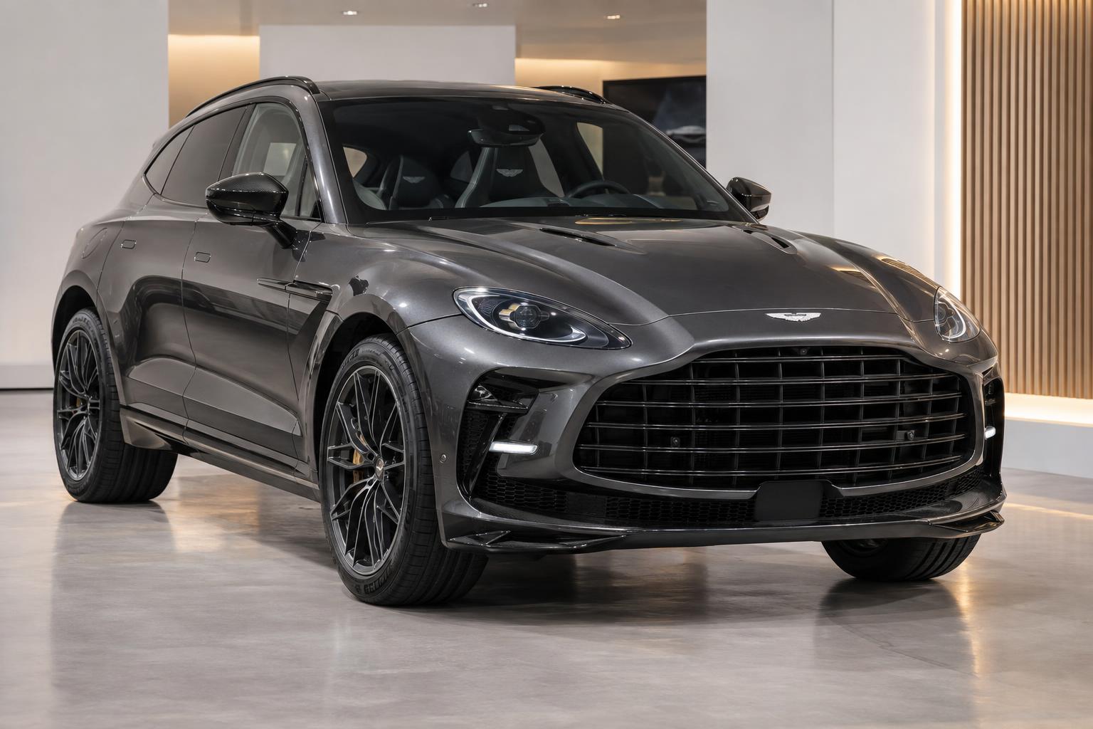 Aston Martin DBX GT presented in a minimalist reveal space at Gaydon.
