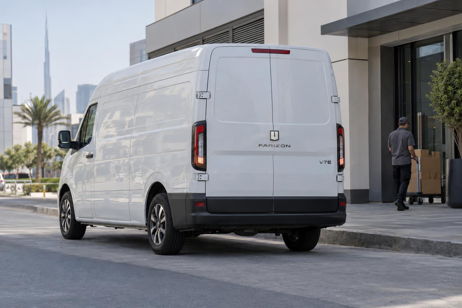 Farizon V7E electric van approaching a delivery stop in a Dubai business district.
