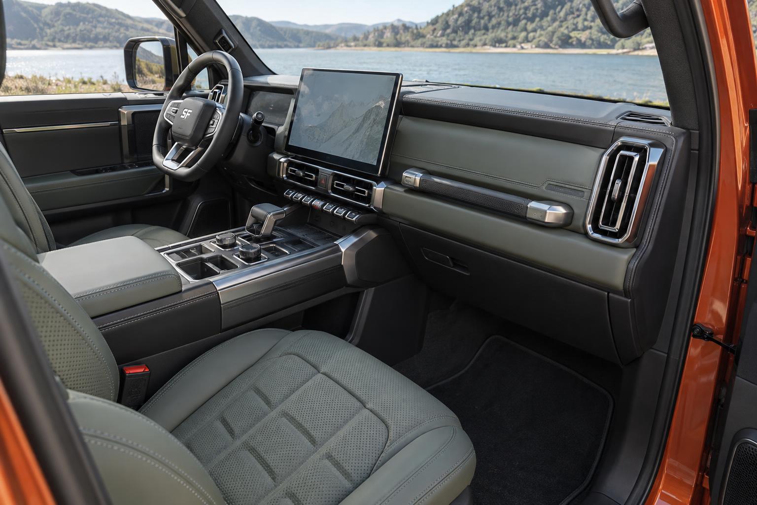 Front cabin of the Jetour G700 TopFire showing the dashboard, center console and front seats.