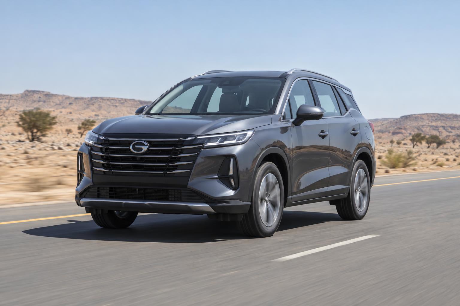 A 2026 GAC GS4 driving on a highway through a Saudi desert-edge landscape.