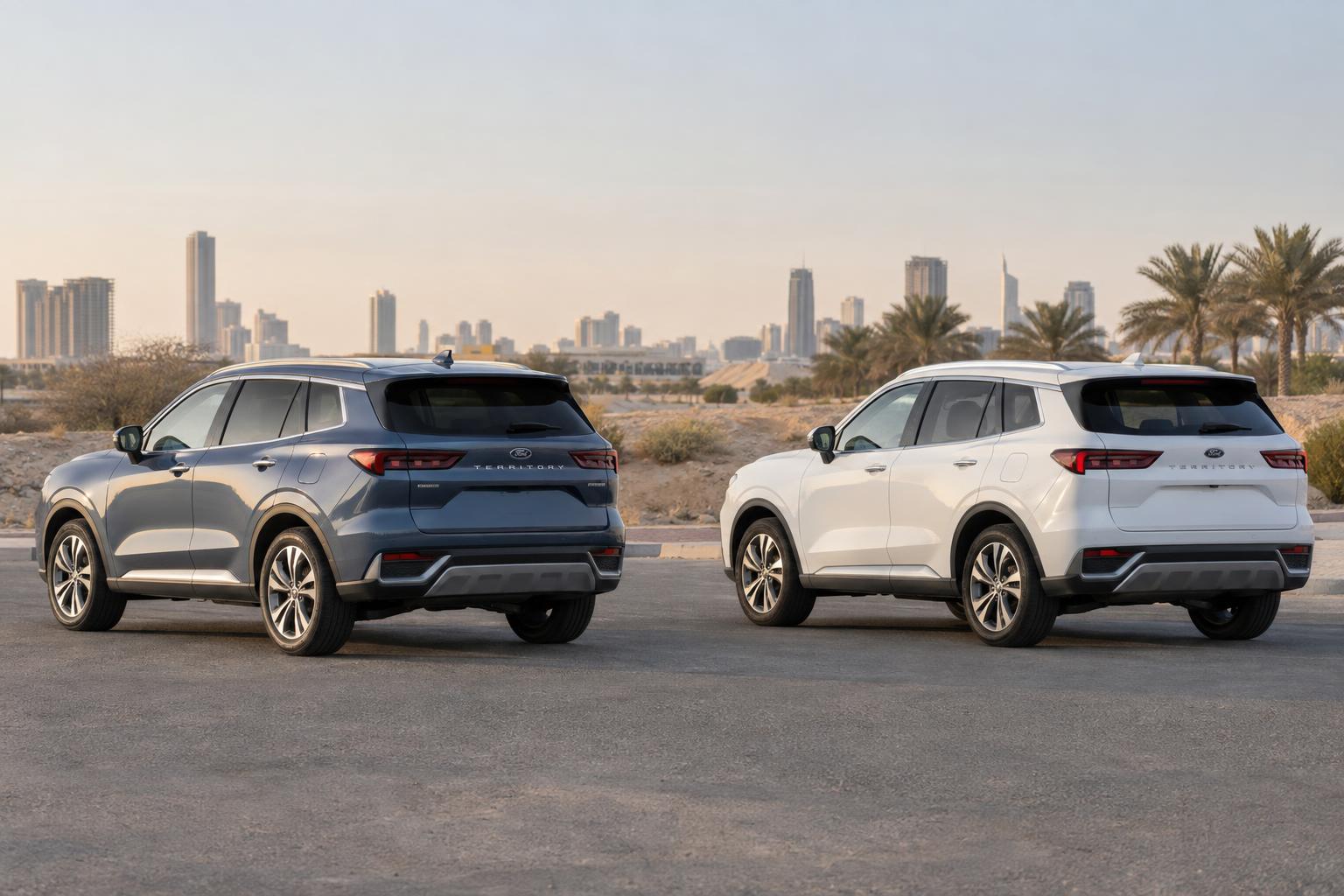 Hybrid and petrol Ford Territory SUVs parked for a visual comparison in the UAE.