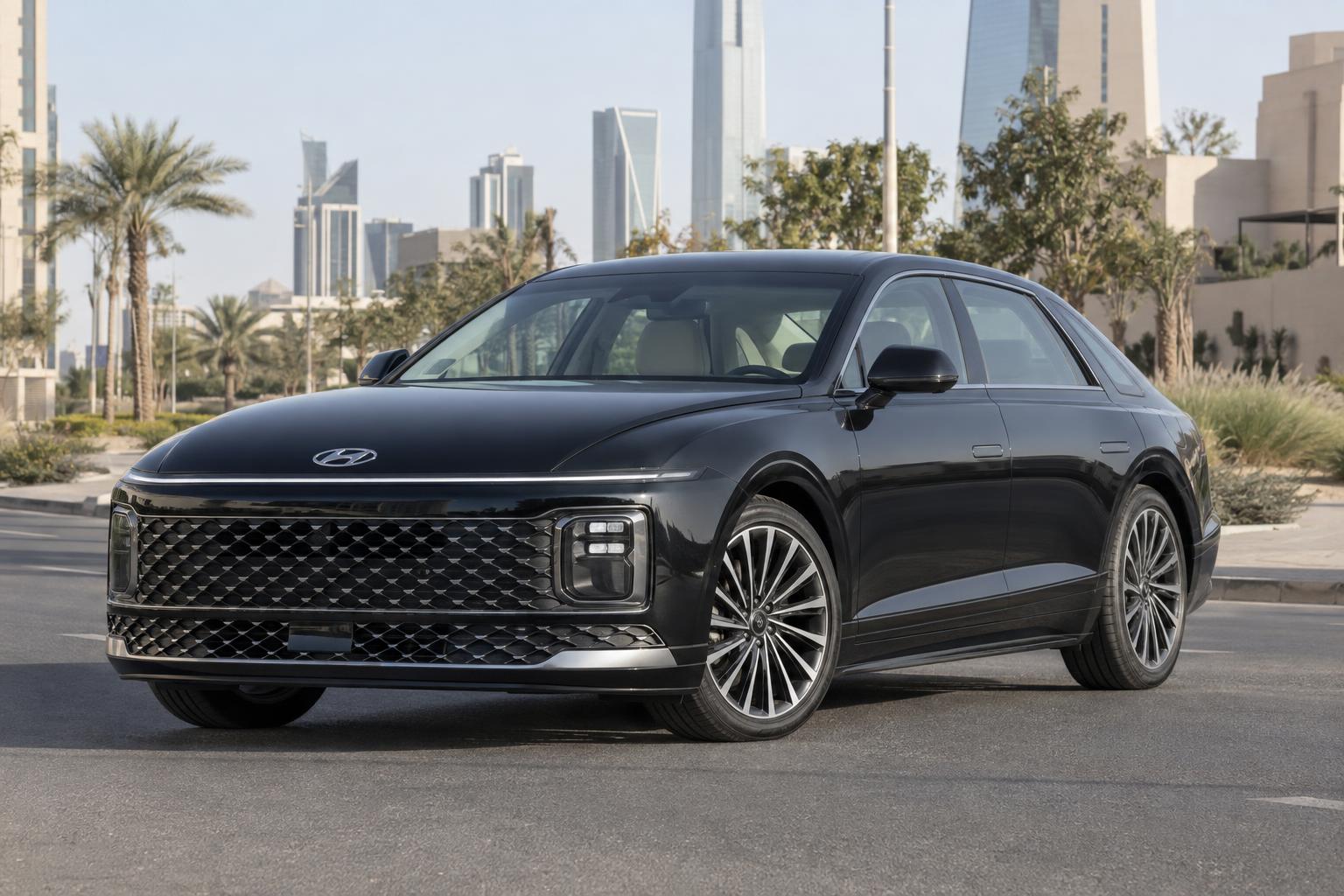Front three-quarter view of a 2023–2025 Hyundai Azera sedan on a Saudi city street.