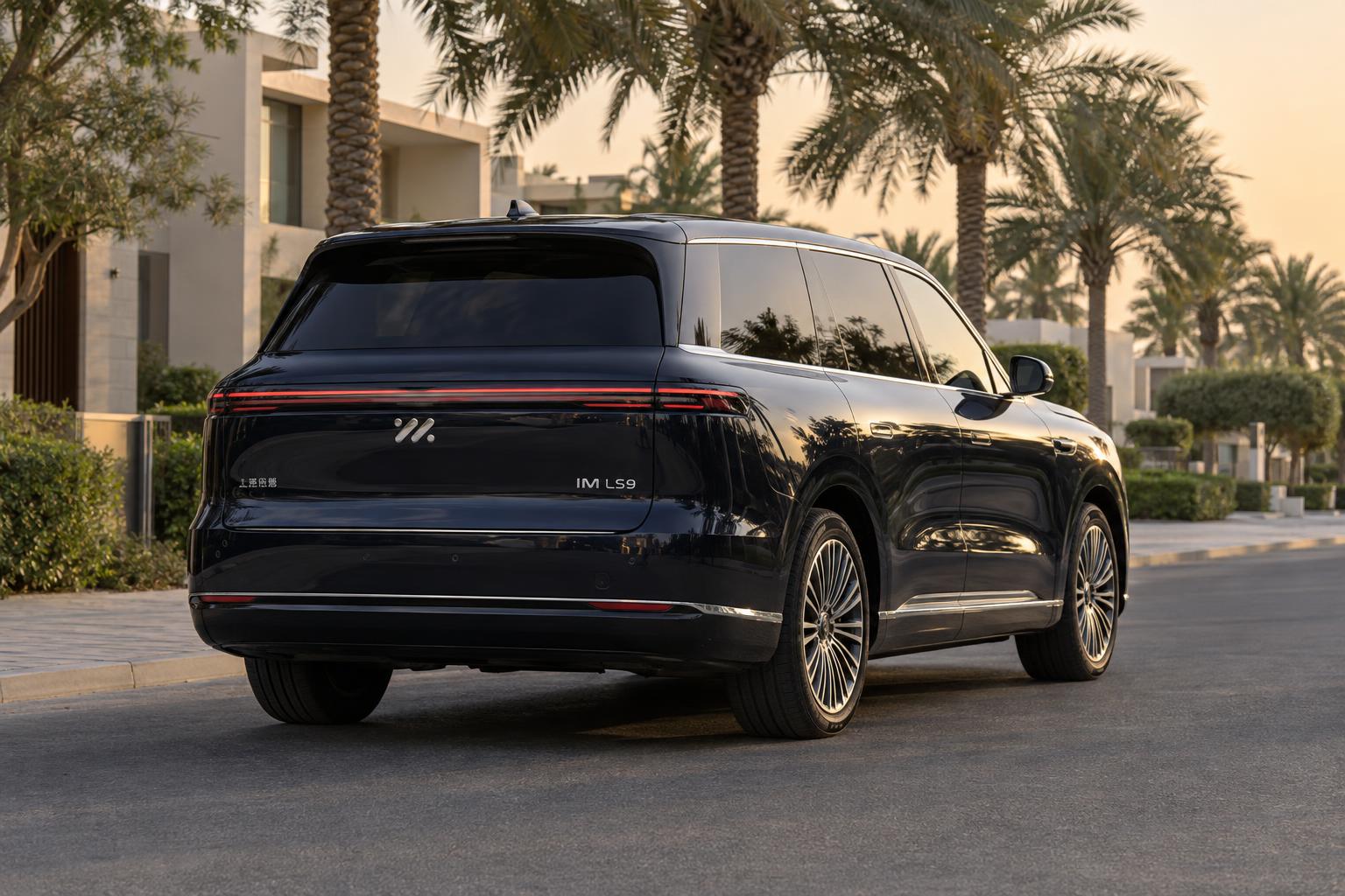 Rear three-quarter view of the IM LS9 on an upscale UAE street.