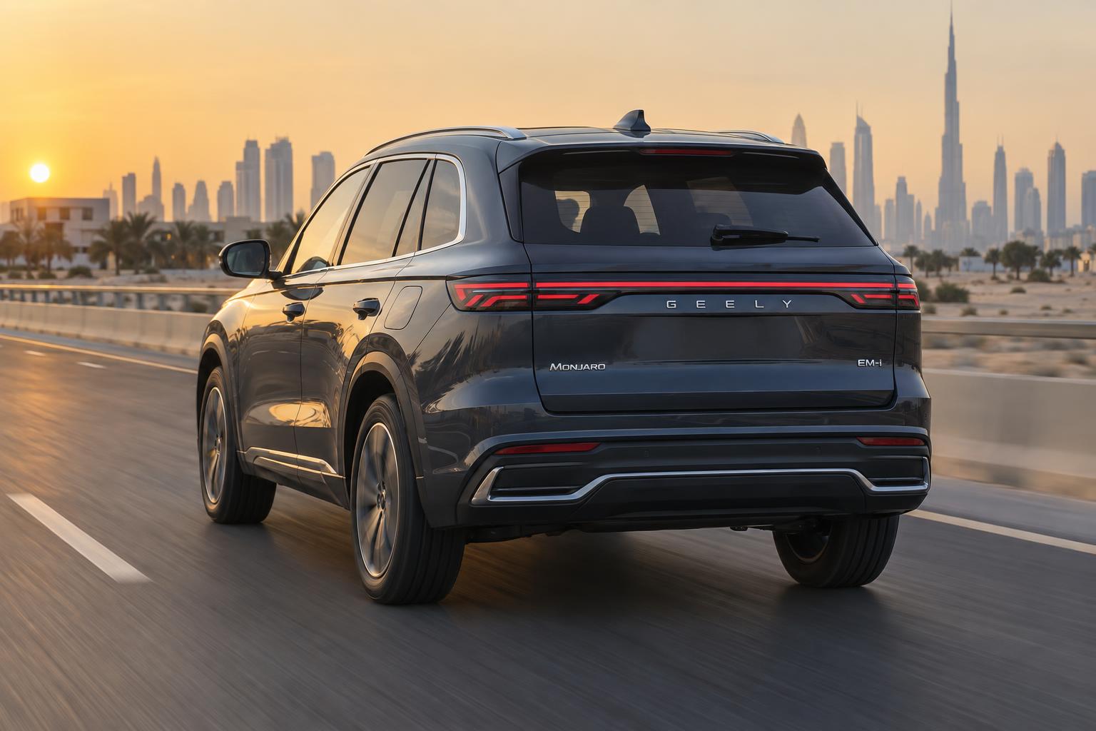Rear three-quarter view of a Geely Monjaro EM-i driving on a modern UAE highway.