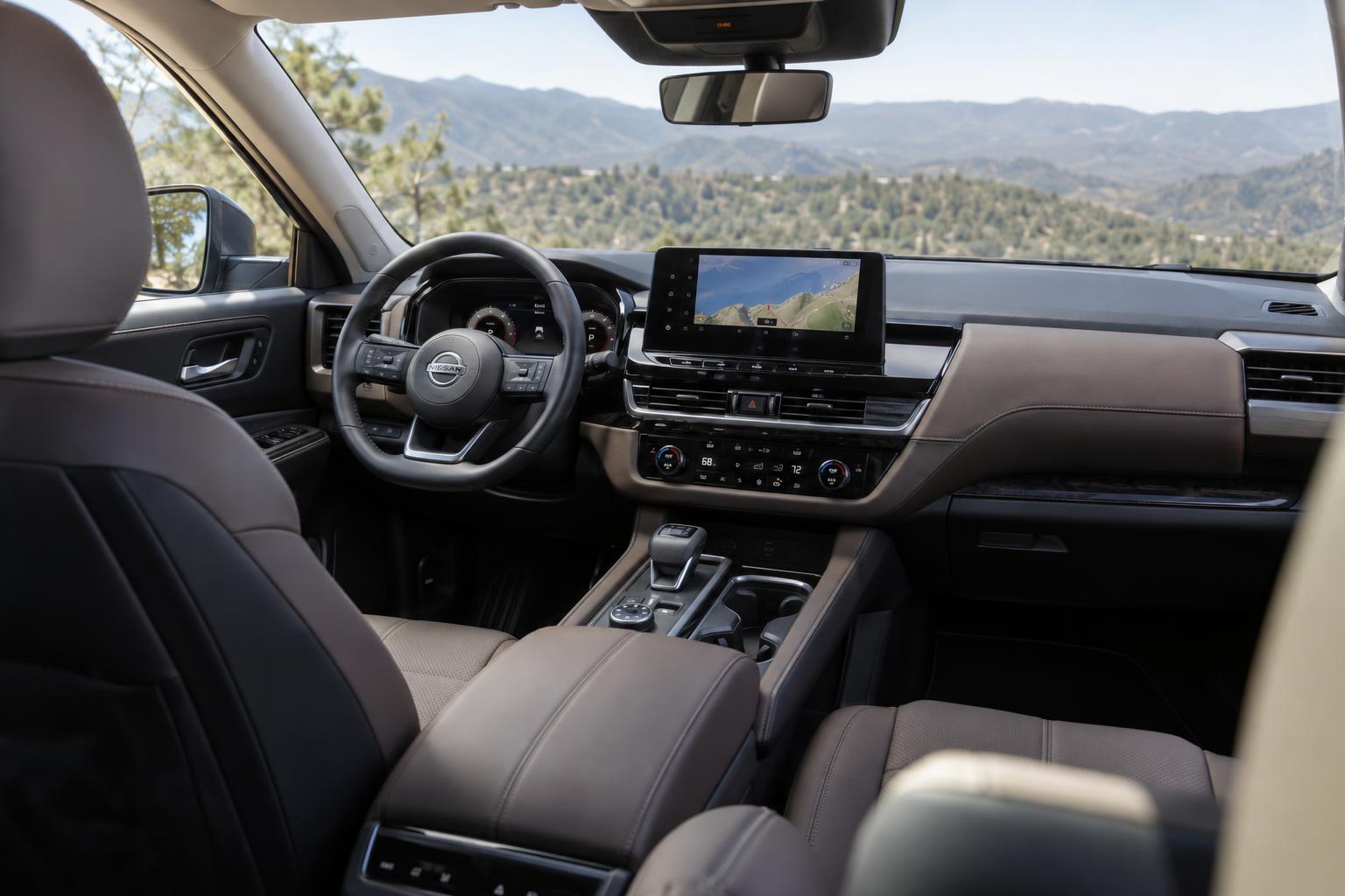 The 2026 Nissan Pathfinder cabin with its large central touchscreen and front dashboard in view.