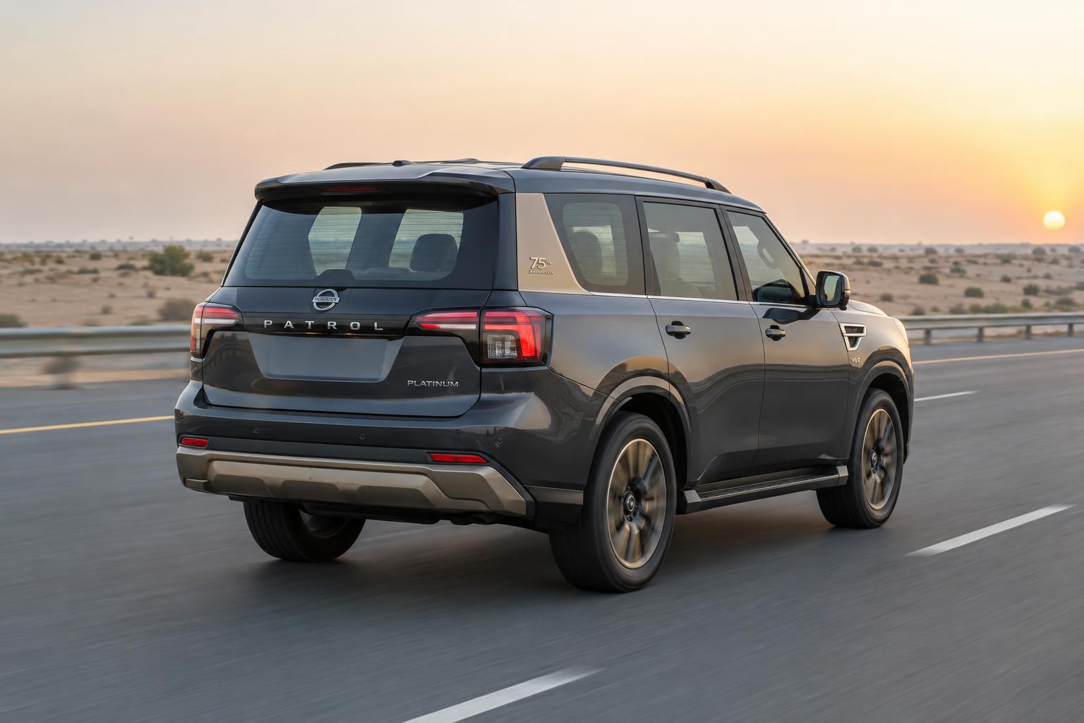 Rear three-quarter rolling view of the Nissan Patrol 75th Anniversary Edition on a Gulf highway.