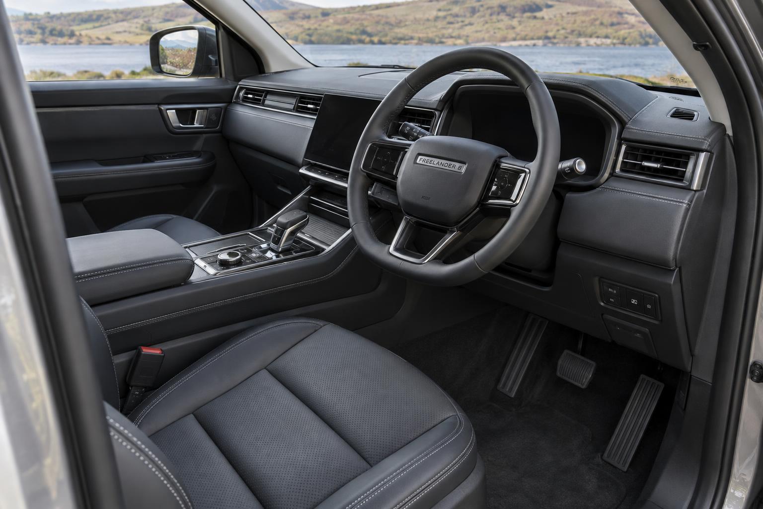 View across the right-hand-drive front cabin of a FREELANDER 8.