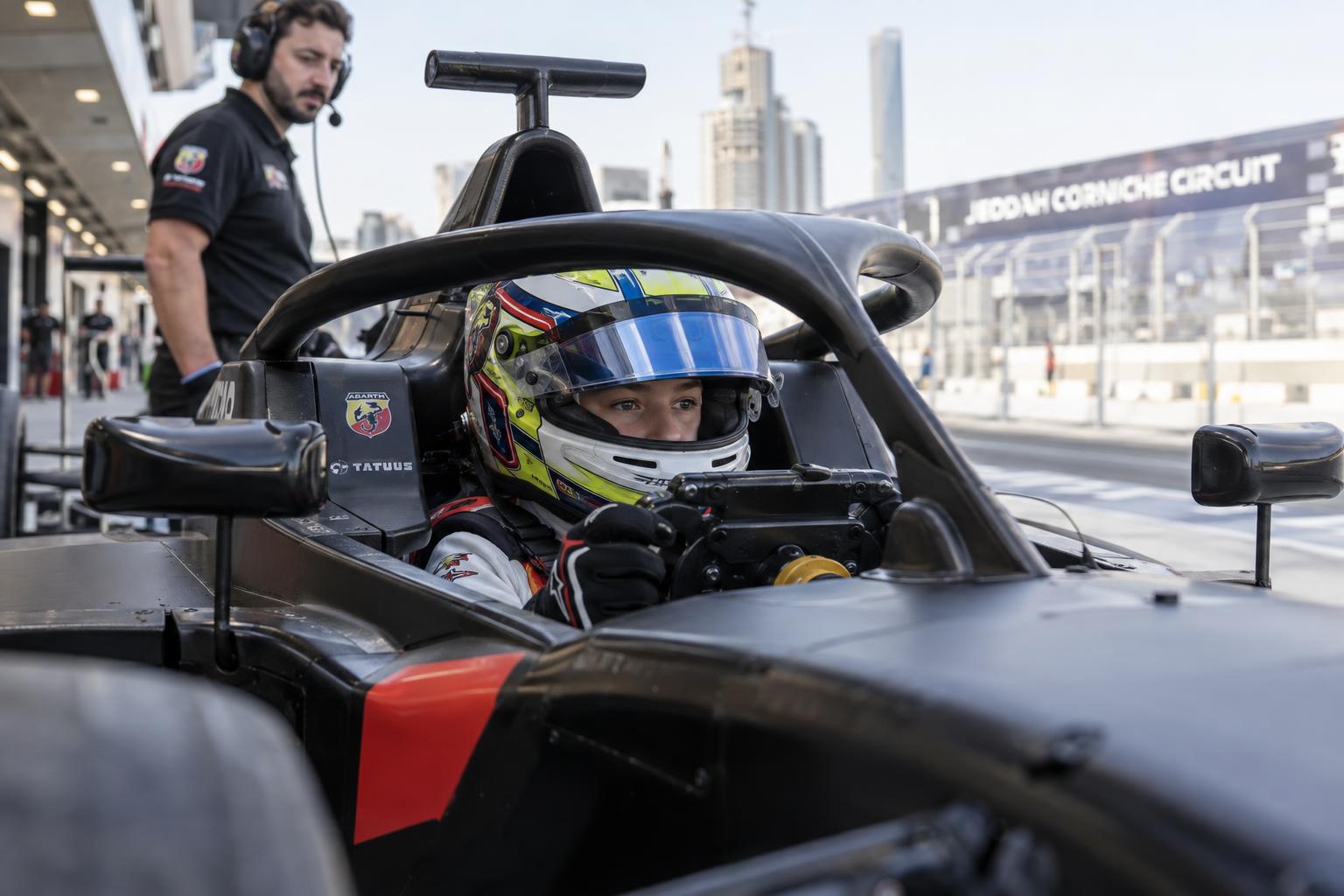 A young driver sits in a Formula 4 cockpit before heading out at Jeddah.