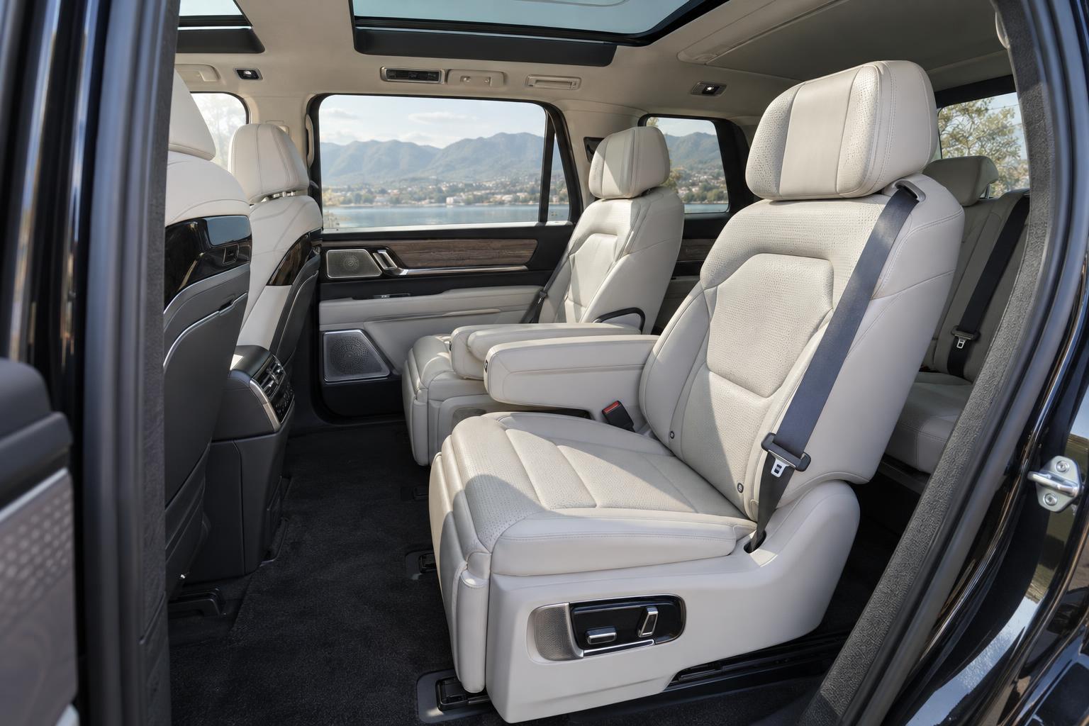 Second-row captain's chairs and third-row access inside the Zeekr 9X.
