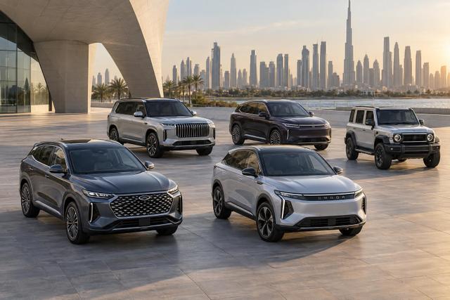 Five different Chery Group new-energy crossovers and SUVs arranged in a Dubai forecourt.