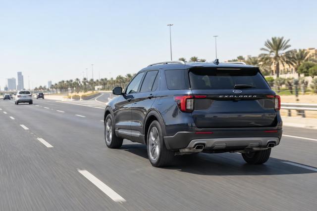A Ford Explorer driving on a multi-lane Saudi highway.