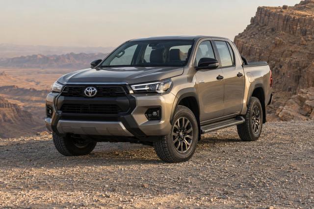 Front three-quarter view of the ninth-generation Toyota Hilux on a gravel desert turnout.