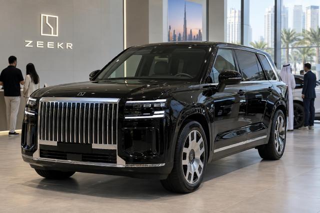 A Zeekr 9X displayed inside a contemporary Dubai showroom.